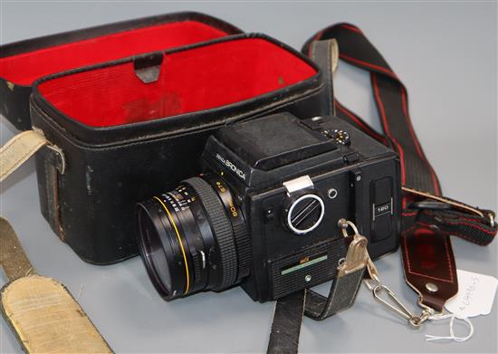 A Zenza Bronica SQ camera with film back and Zenzanon-S 1=2.8 f=80mm lens, cased